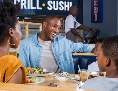Spur Gifting image - man smiling while looking at his phone
